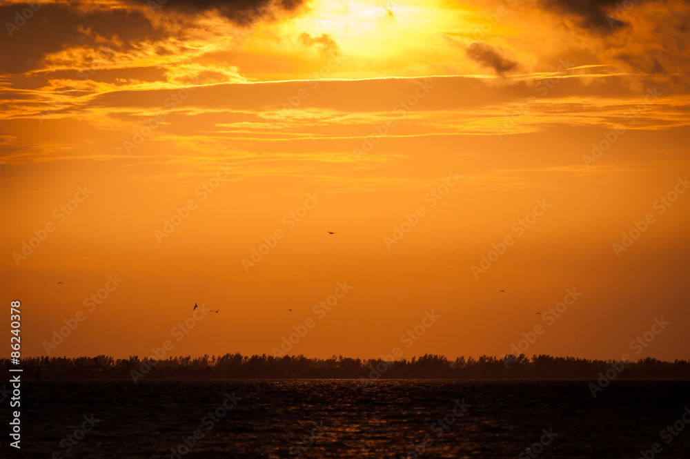 Orange sunset over water