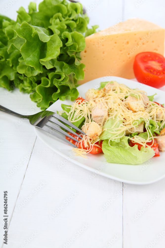 Caesar salad in a white plate Caesar salad in a white plate