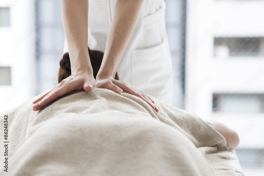 Women receiving back massage Women receiving back massage