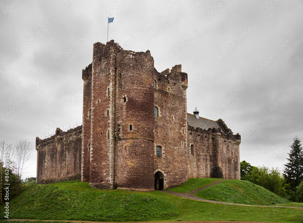 Doune Castle  on a cloudy spring day. Doune Castle is a medieval stronghold near the village of Doune, in the Stirling district, central Scotland, UK