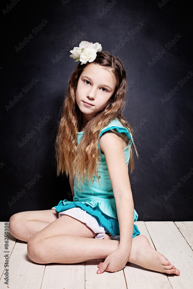Cute Child Girl. Portrait of Young Teen on Dark Background Stock Photo