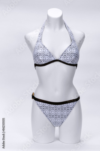 Mannequin, wearing a bikini, on white background photo