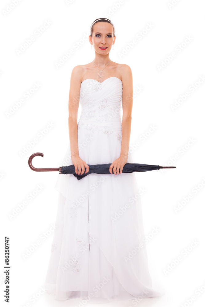 Full length bride in wedding gown holds umbrella Full length bride in wedding gown holds umbrella