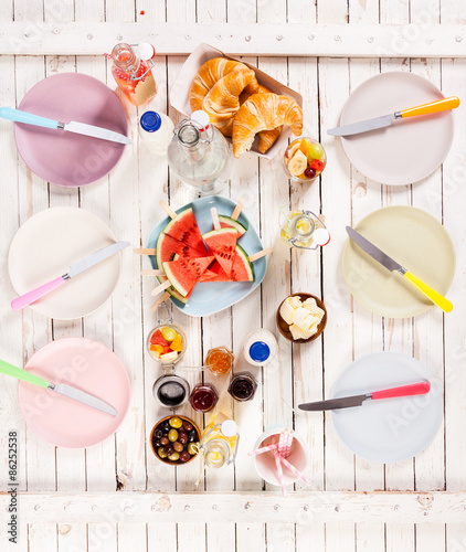 Summer lunch served on a picnic table outdoors photo