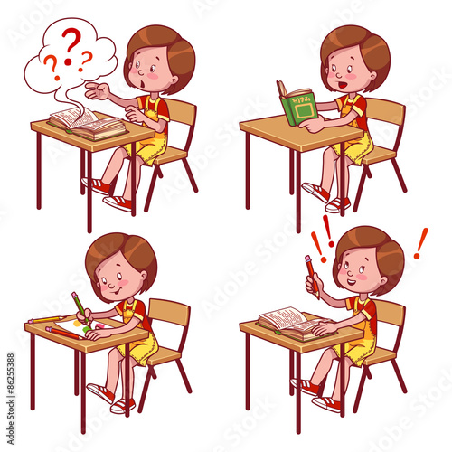 Cute schoolgirl behind a school desk.