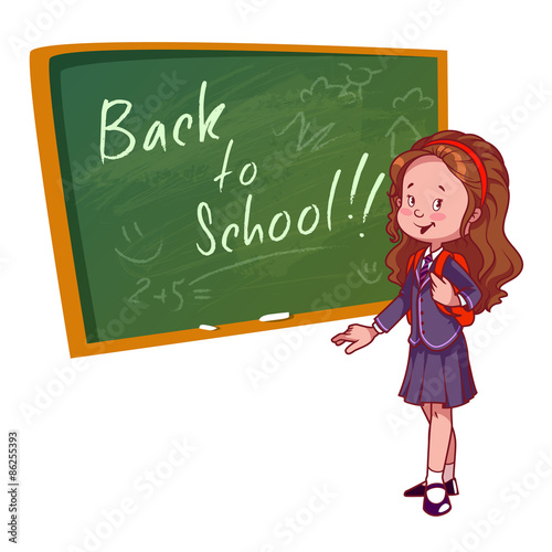 Cute schoolgirl in uniform stands near the school board