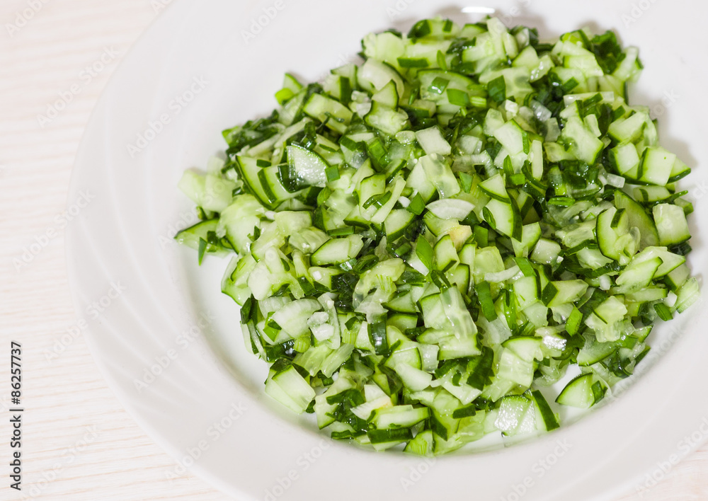 Green vegetable salad of cucumbers, spring onion Green vegetable salad of cucumbers, spring onion