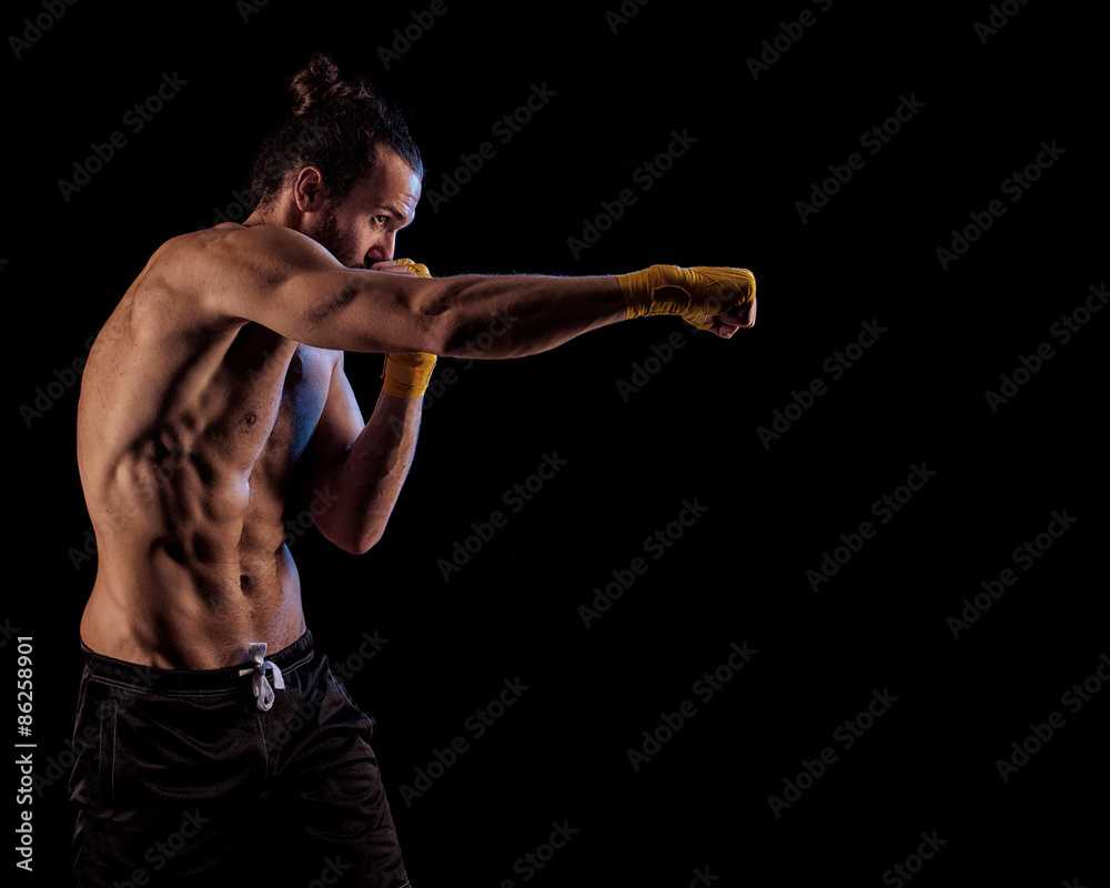 A man in a boxing stand. A man in a boxing stand.