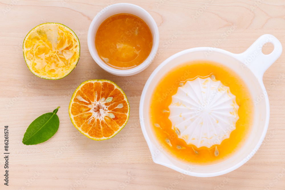 Freshly orange juice with orange slice set up on wooden table . Freshly orange juice with orange slice set up on wooden table .