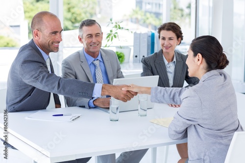 Interview panel listening to applicant