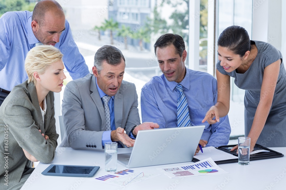 Business team working together on laptop Business team working together on laptop