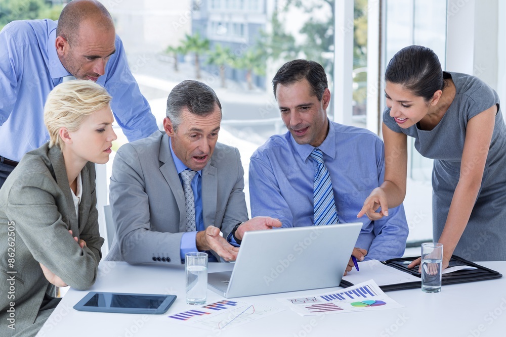 Business team working together on laptop