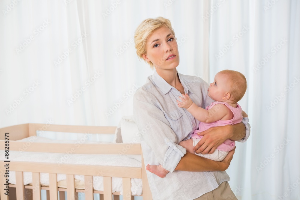 Beauitiful woman holding her baby girl Beauitiful woman holding her baby girl