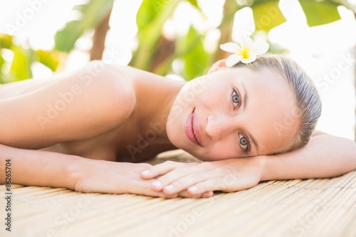 Peaceful blonde lying on massage table