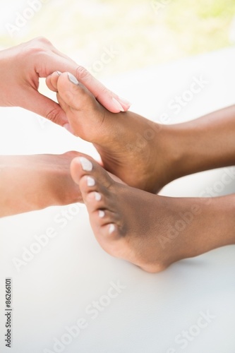 Close-up of a woman receiving foot massage