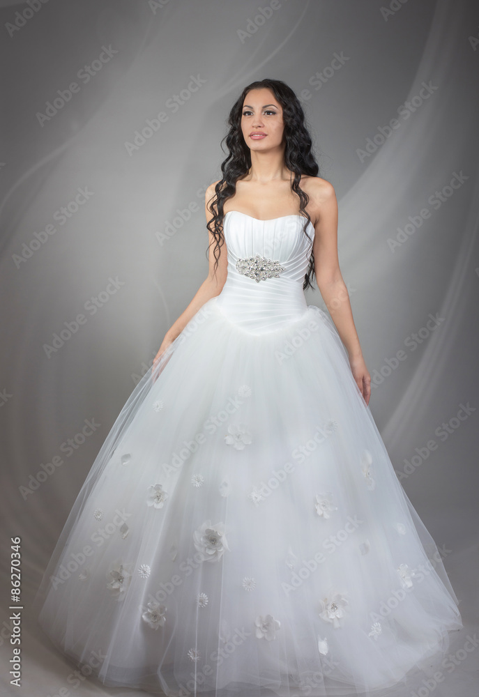 Full length portrait of happy beautiful bride