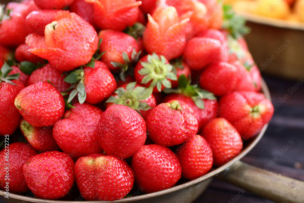 dish with fresh strawberries closeup