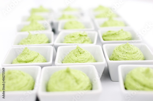 butter mixed with herbs in small plates at the buffet