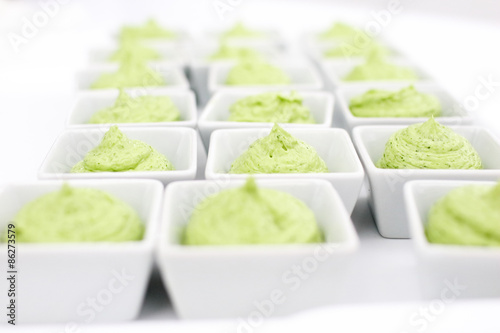 butter mixed with herbs in small plates at the buffet
