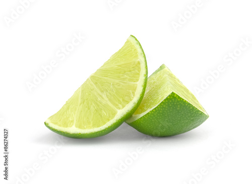 fresh lime wedge isolated on a white background