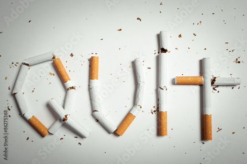 Broken cigarettes arranged as a word quit