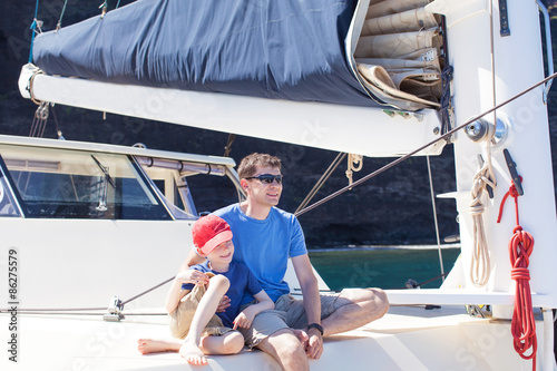family at sailing boat