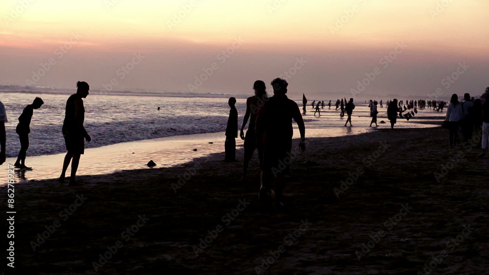 People playing soccer on beach during sunset
People playing soccer on beach during sunset