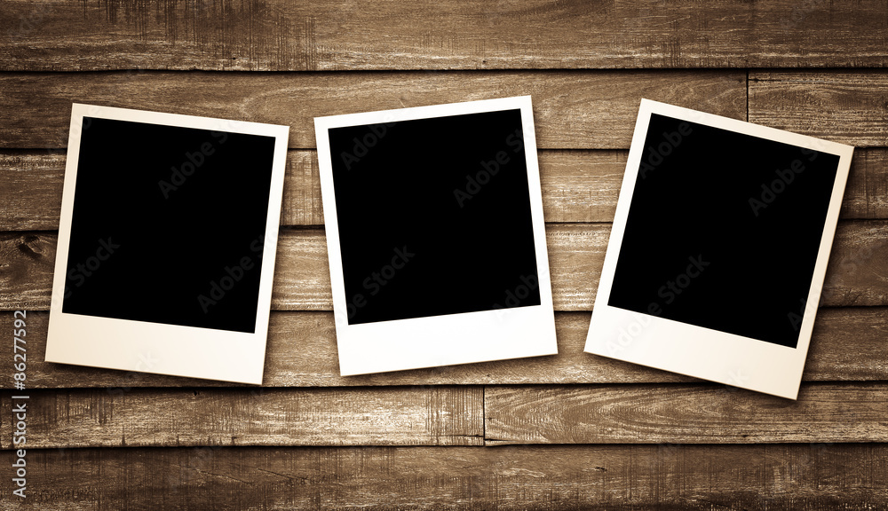 Blank photo frames on wood background Blank photo frames on wood background