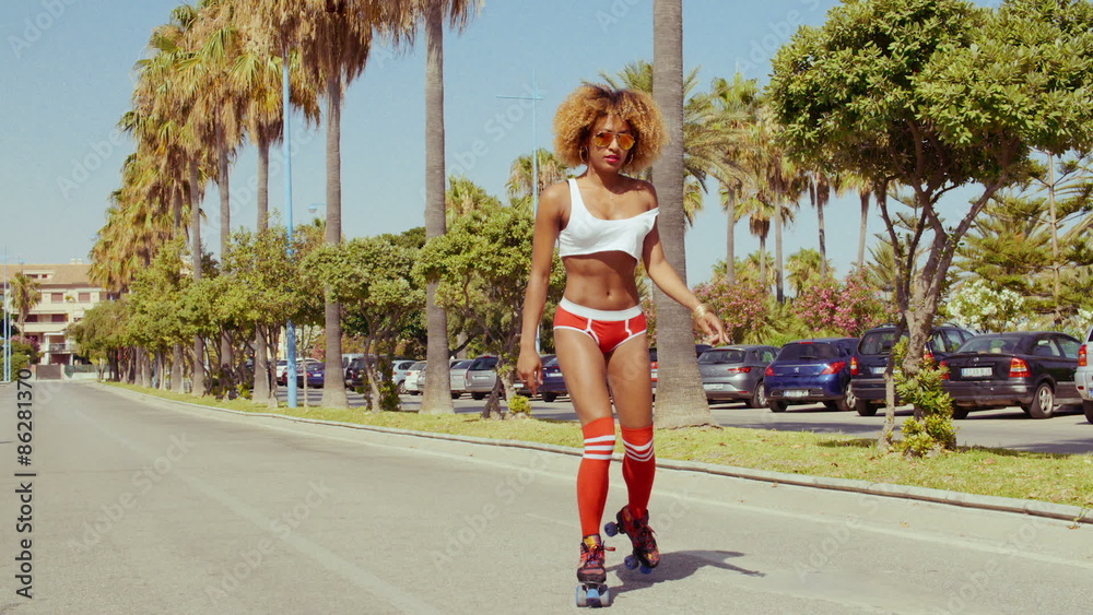 Sexy Afro American Girl in Shorts on Roller Skates