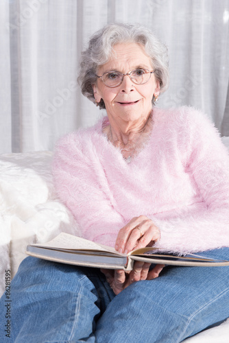 active female senior relaxing on couch