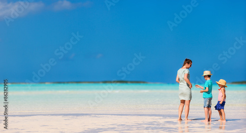 Mother and kids on a tropical beach © BlueOrange Studio