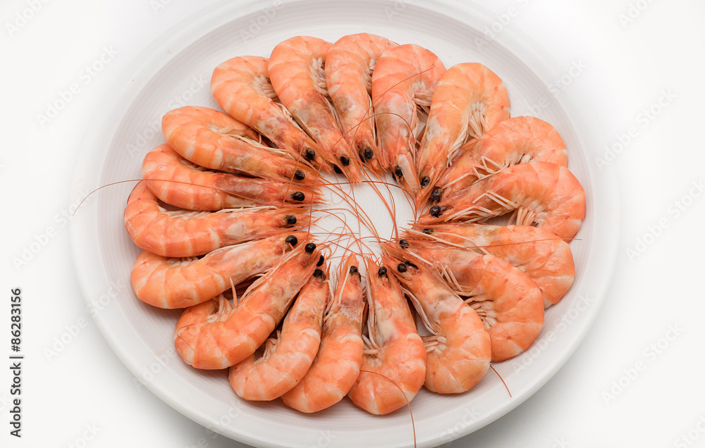 king prawns cooked isolated on white background on dish and plac king prawns cooked isolated on white background on dish and plac
