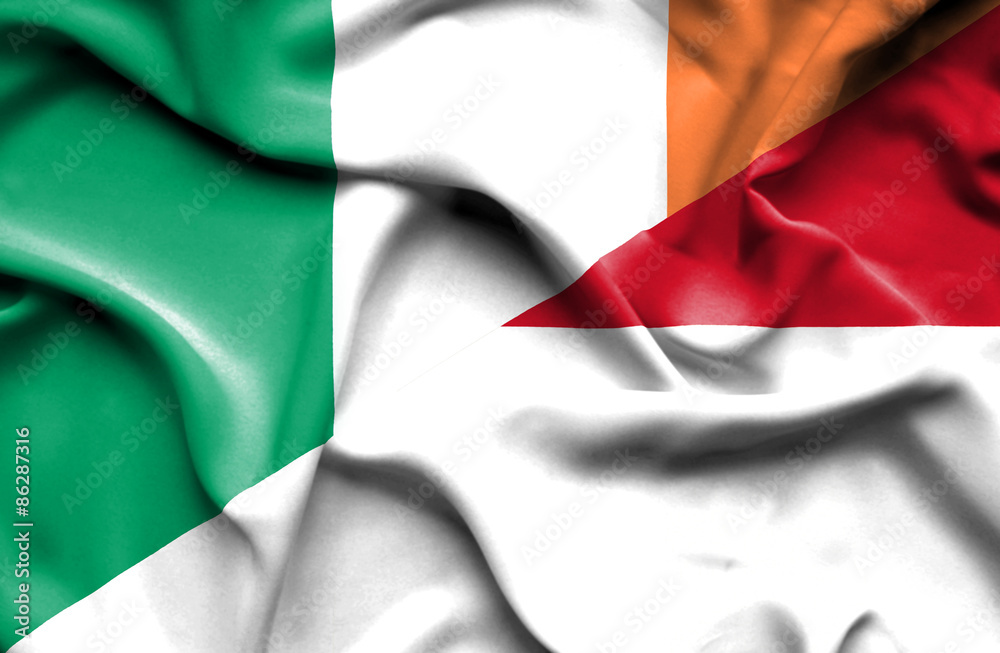 Obraz premium Waving flag of Indonesia and Ireland