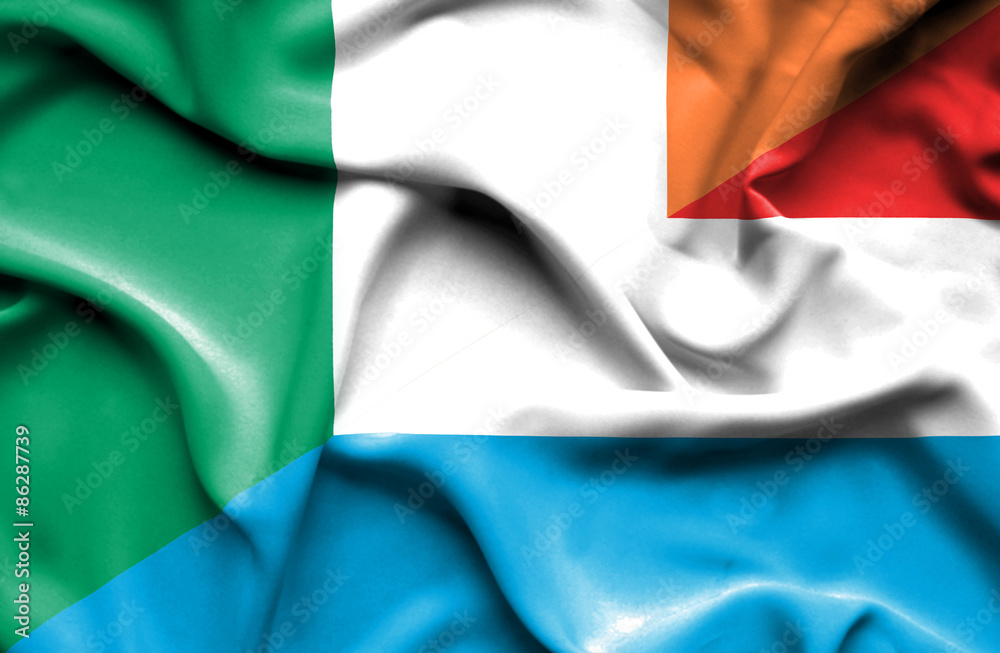 Obraz premium Waving flag of Luxembourg and Ireland