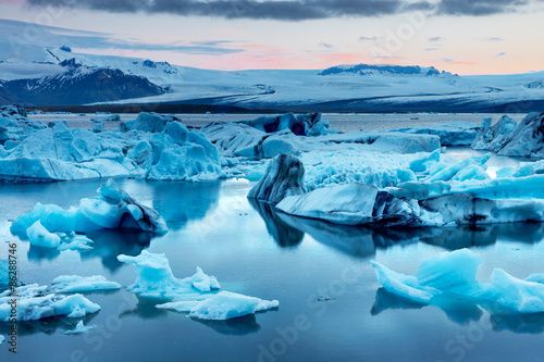 The Jokulsarlon glacier lagoon in Iceland during a bright summer night photo