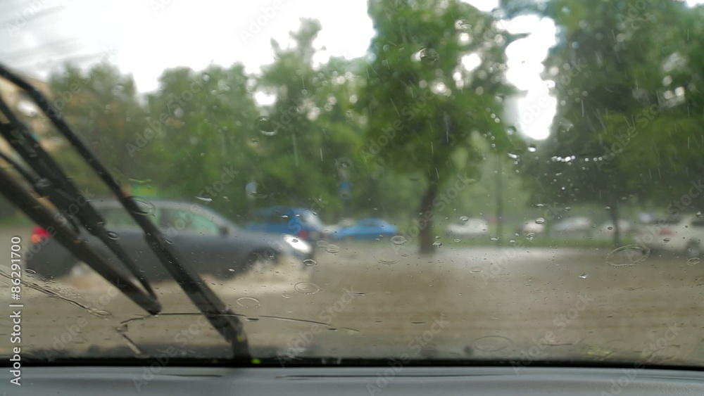 Close-up of raindrops on the windshield of the car. Windshield