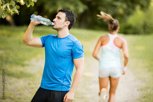 Young man drinking water