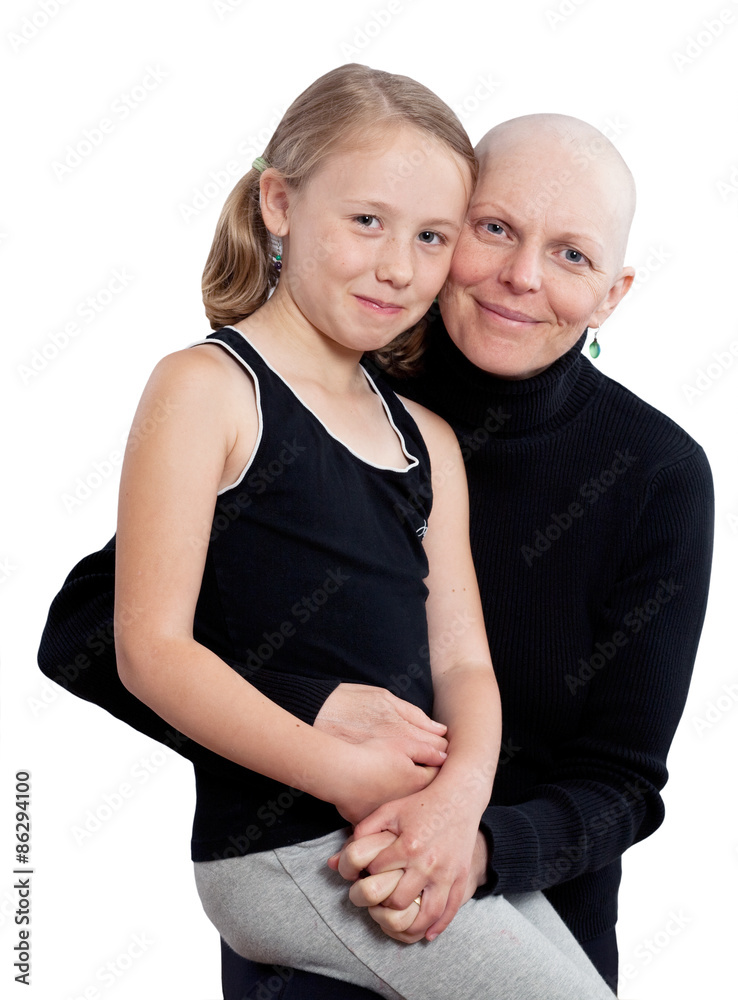 Studio portrait on white of a bald mother fighting breast cancer with her young daughter. Studio portrait on white of a bald mother fighting breast cancer with her young daughter.