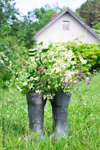 Rubber boots in a meadow © maramicado