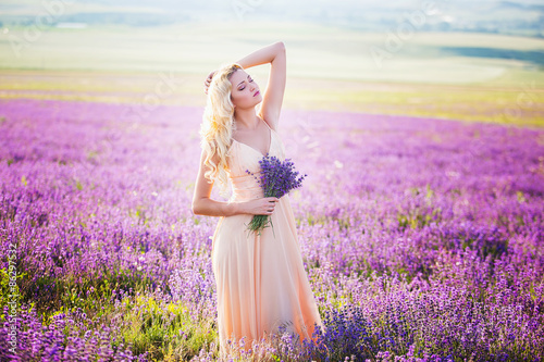 Portrait of a beautiful girl on the lavender field.
