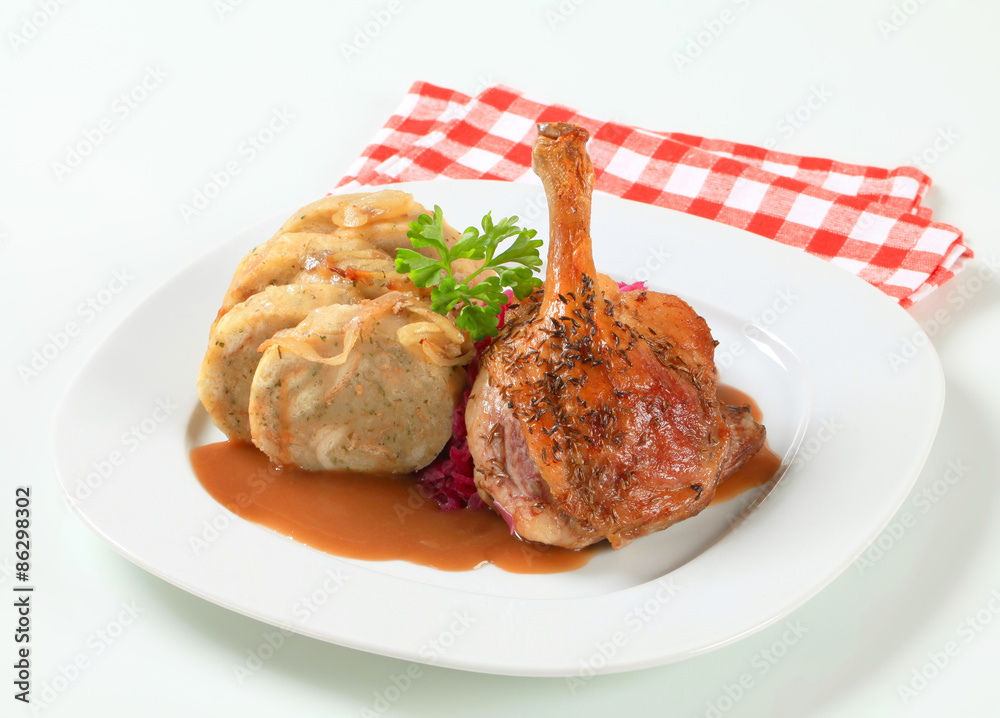Roast duck with bread dumplings and red cabbage