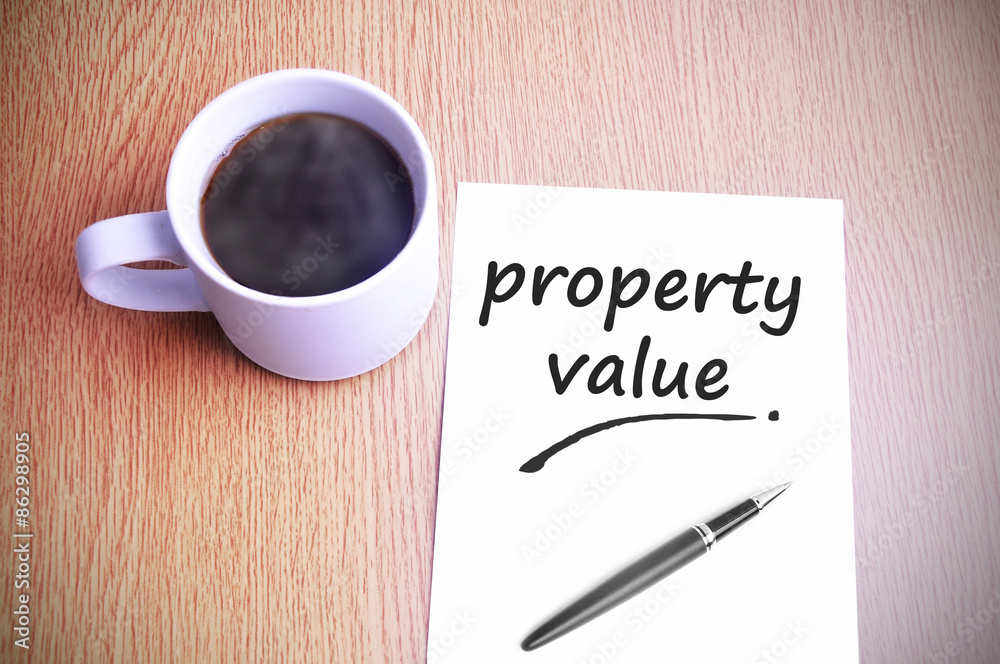Coffee on the table with note writing property value Coffee on the table with note writing property value
