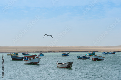 boats on the blue lake with bird. © sharptoyou