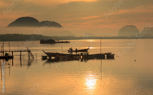 Good morning fishing village and sunrise at Sam Chong-tai, Phang Nga, Thailand, edit warm tone