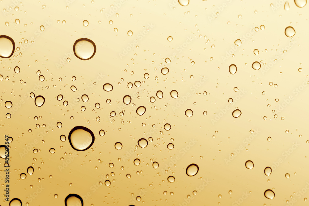 Gold water drop on glass mirror background. Gold water drop on glass mirror background.