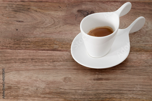 cup of coffee on wooden table
