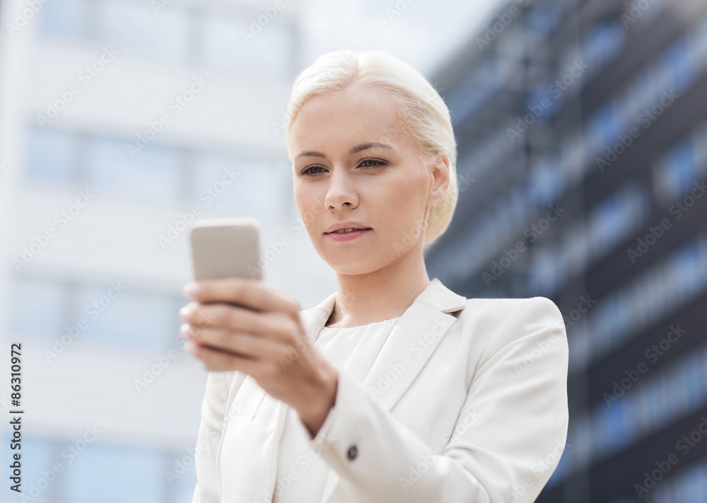 serious businesswoman with smartphone outdoors serious businesswoman with smartphone outdoors