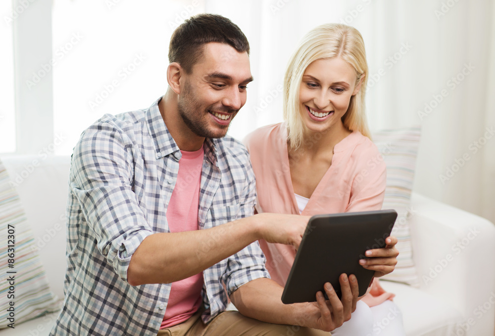 smiling happy couple with tablet pc at home smiling happy couple with tablet pc at home