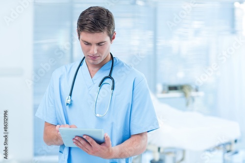 Doctor holding tablet 