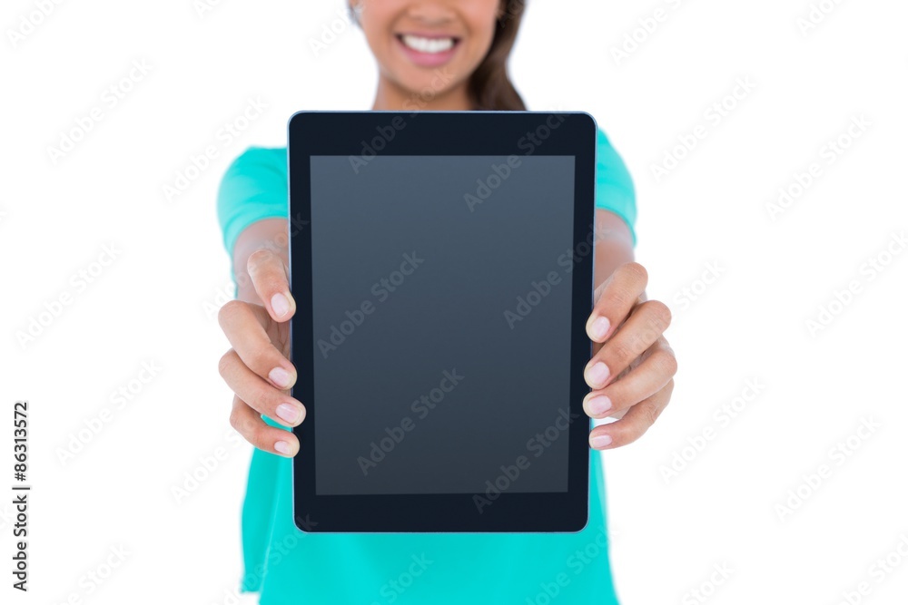 Casual brunette showing tablet computer Casual brunette showing tablet computer